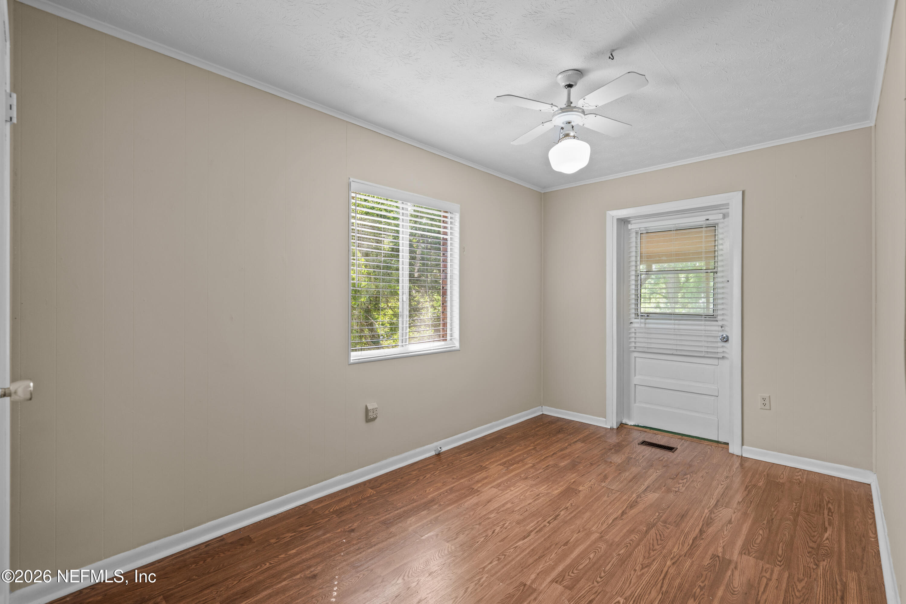253 Cowry Road St. Augustine, FL 32086 - Photo 20 of 27 wooden floor in an empty room with a window