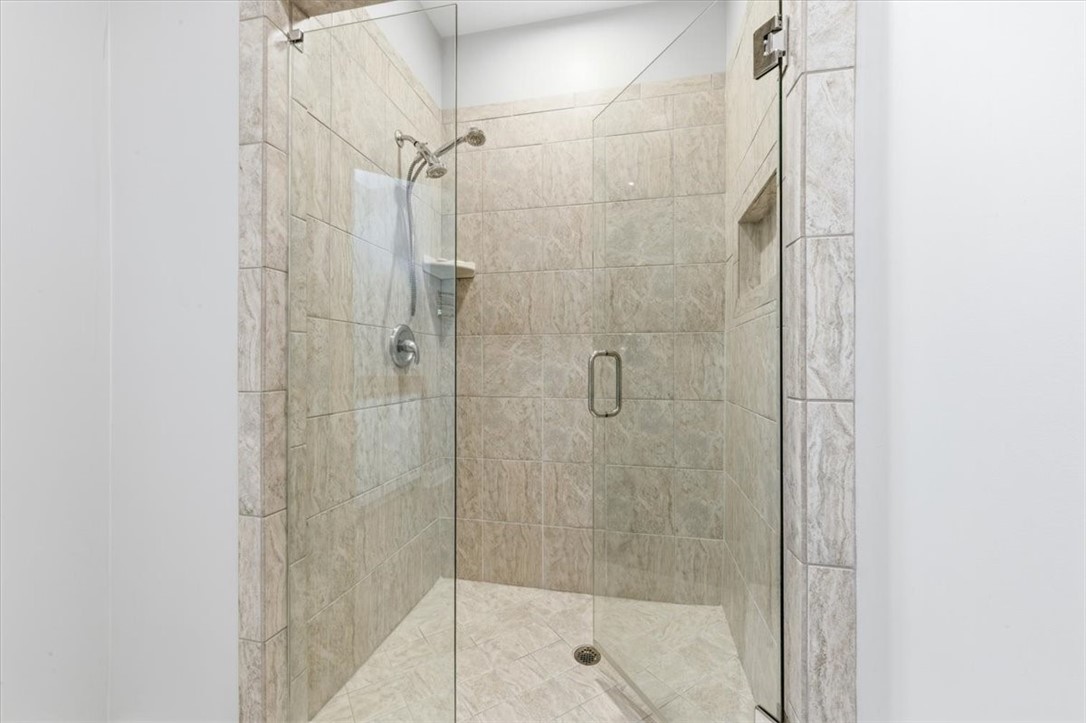 805 King's Grant St. Simons Island, GA 31522 - Photo 27 of 50 Here's the shower for the primary suite.