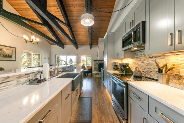 a kitchen with stainless steel appliances granite countertop lots of counter top space