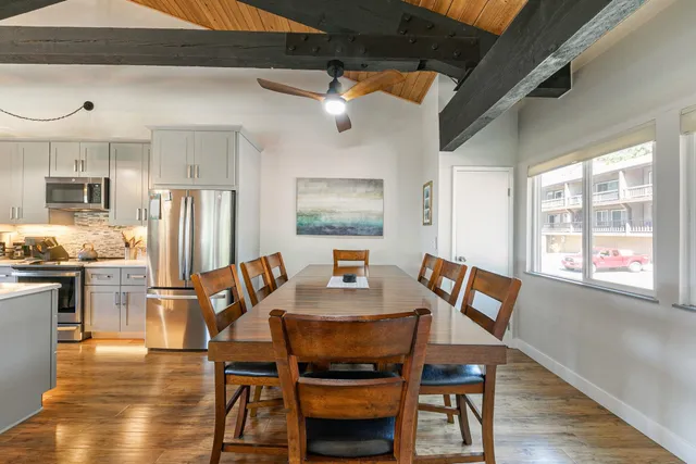a view of a dining room with furniture window and wooden floor