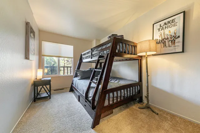 a bedroom with furniture and a window