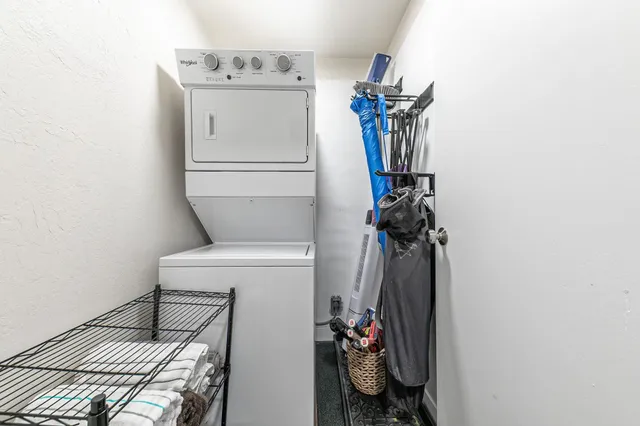 a view of a hallway with storage and utility