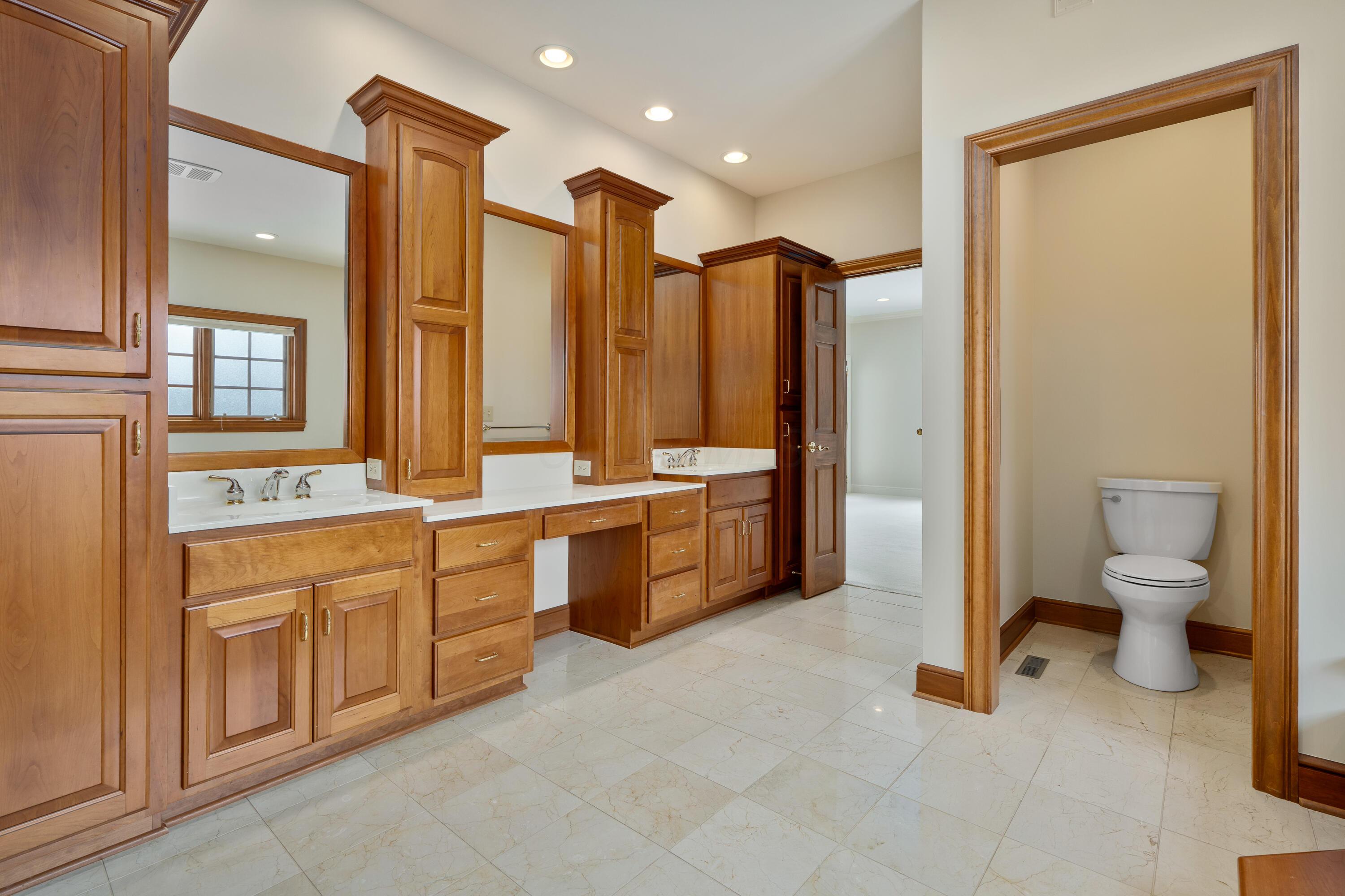 18261 Boerger Road Marysville, OH 43040 - Photo 41 of 94 This view shows the water closet and large 2 sink vanity