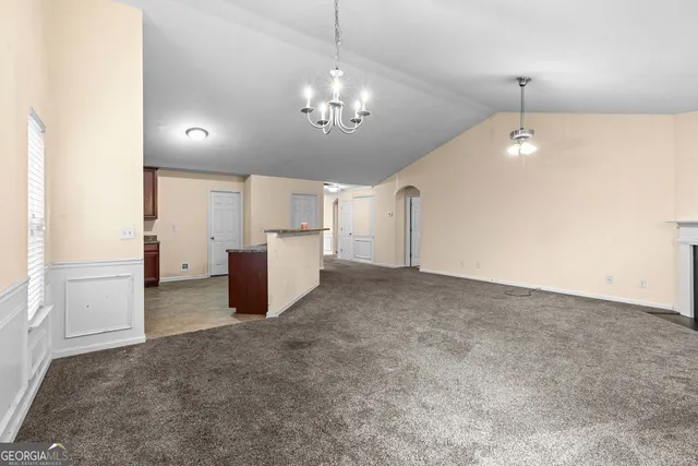 a view of a hallway with chandelier