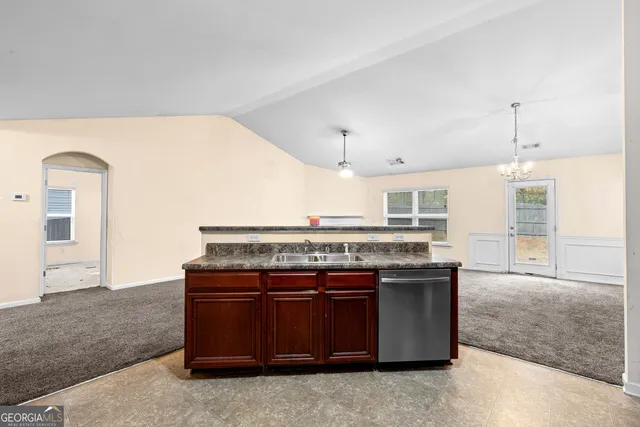 a kitchen with a stove and a sink