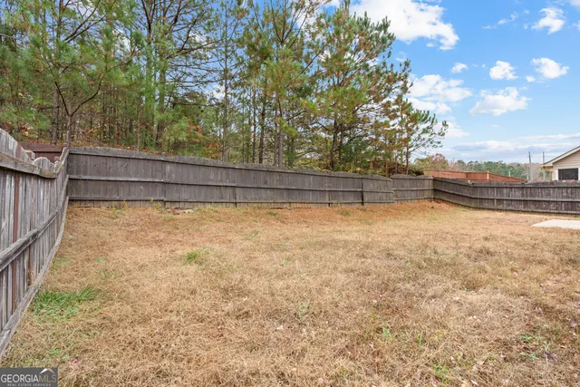 a view of a yard with large tree