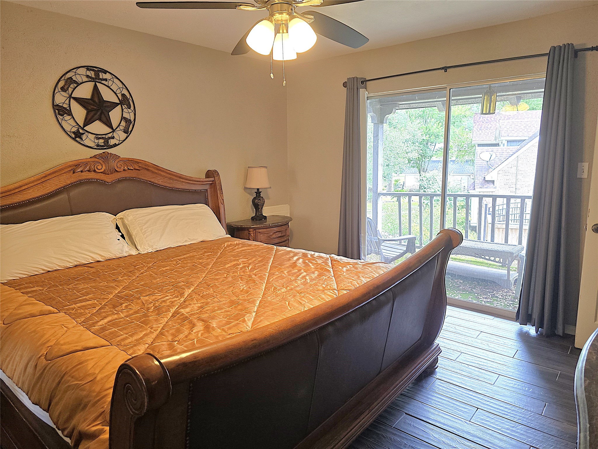 560 Brandon Road Conroe, TX 77302 - Photo 18 of 45 Cozy third bedroom with a charming balcony view, perfect for relaxation.