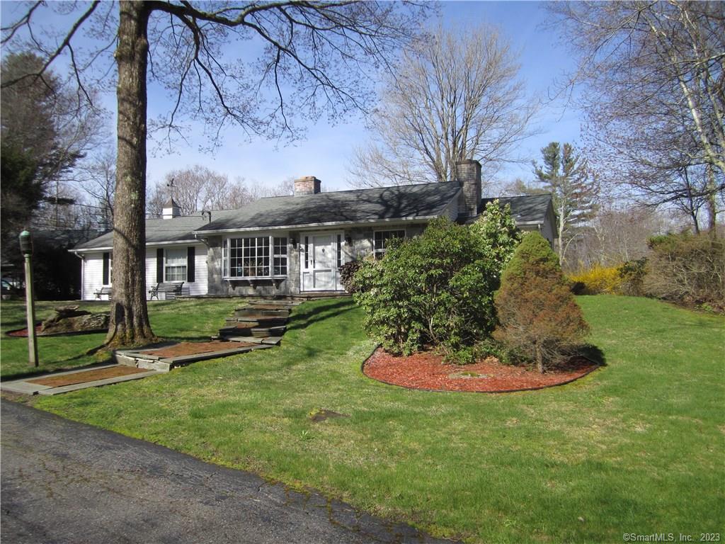 216 Brick School Road Warren, CT 06754 - Photo 1 of 1 a front view of a house with a yard