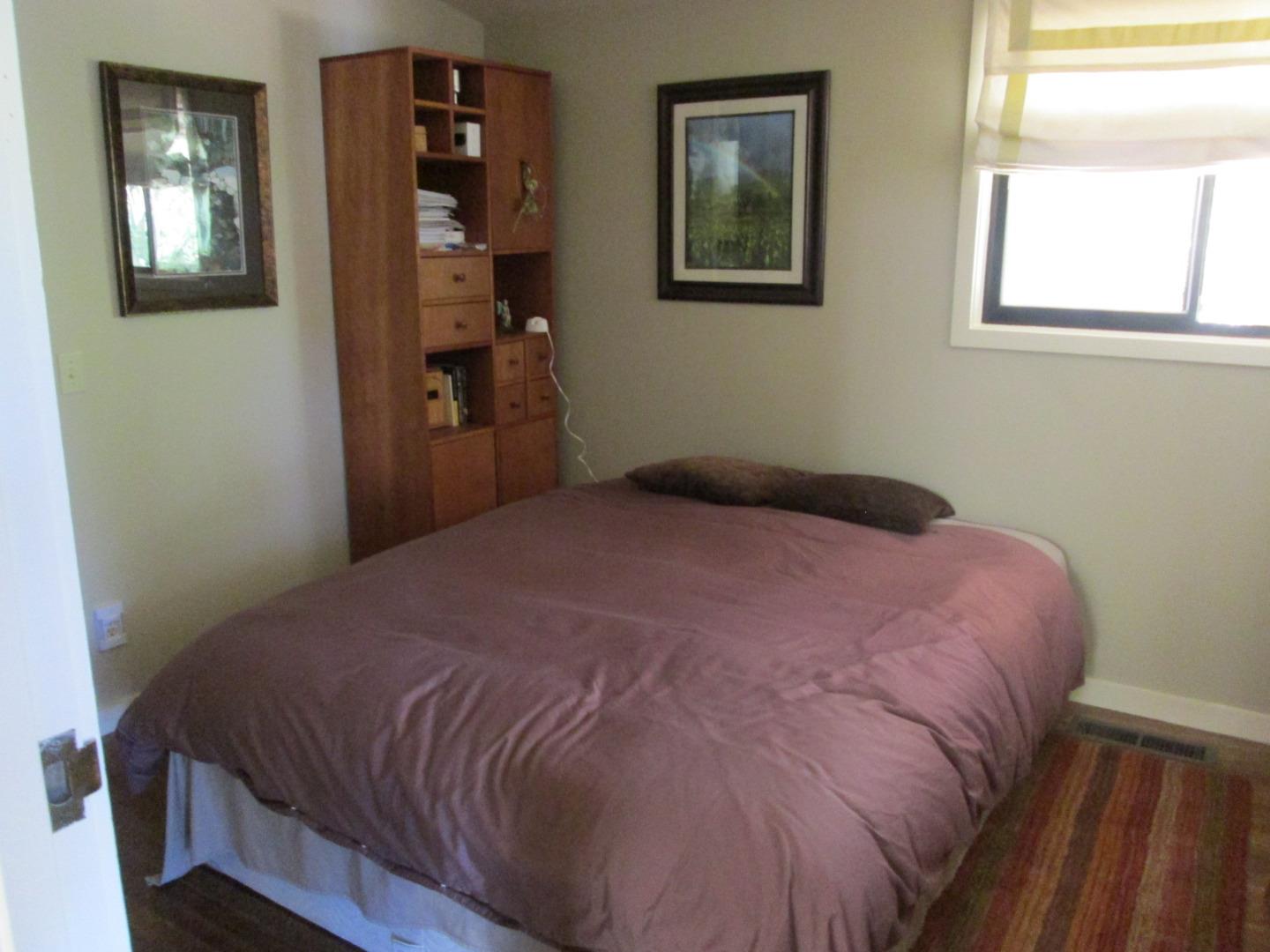 10 Palm Circle Road Woodside, CA 94062 - Photo 6 of 12 a bedroom with a bed and wooden floor
