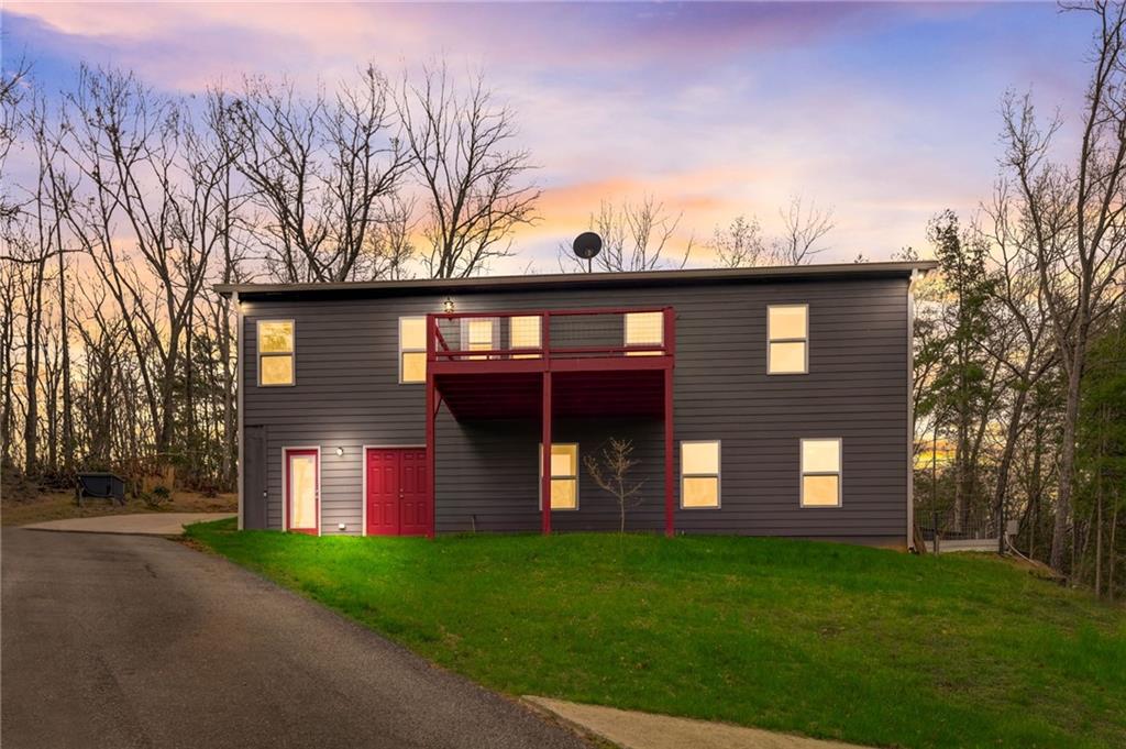 a view of a house with a backyard