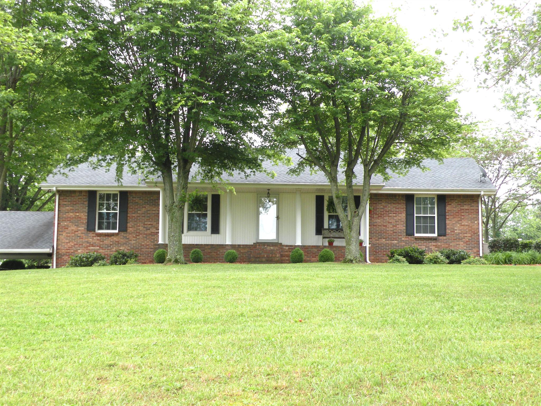 304 Haynes Road Portland, TN 37148 - Photo 1 of 21 a front view of house with yard and trees