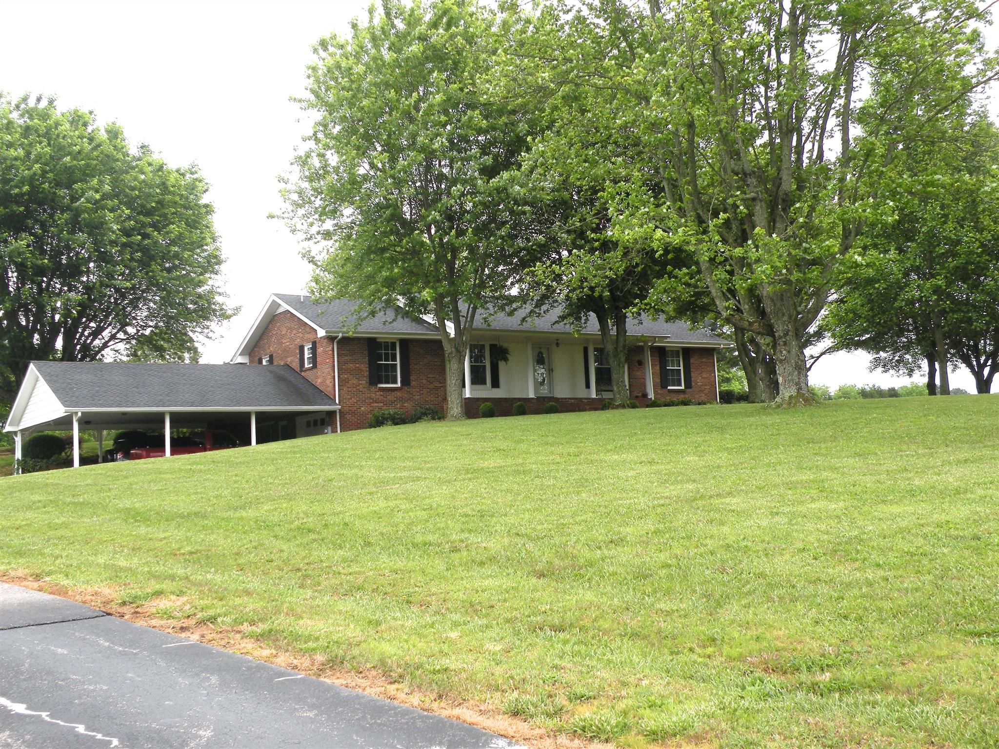 304 Haynes Road Portland, TN 37148 - Photo 2 of 21 a front view of a house with a garden