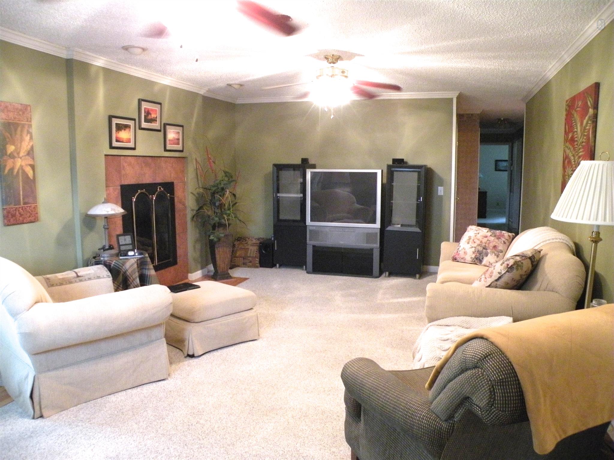 304 Haynes Road Portland, TN 37148 - Photo 12 of 21 a living room with furniture and a flat screen tv
