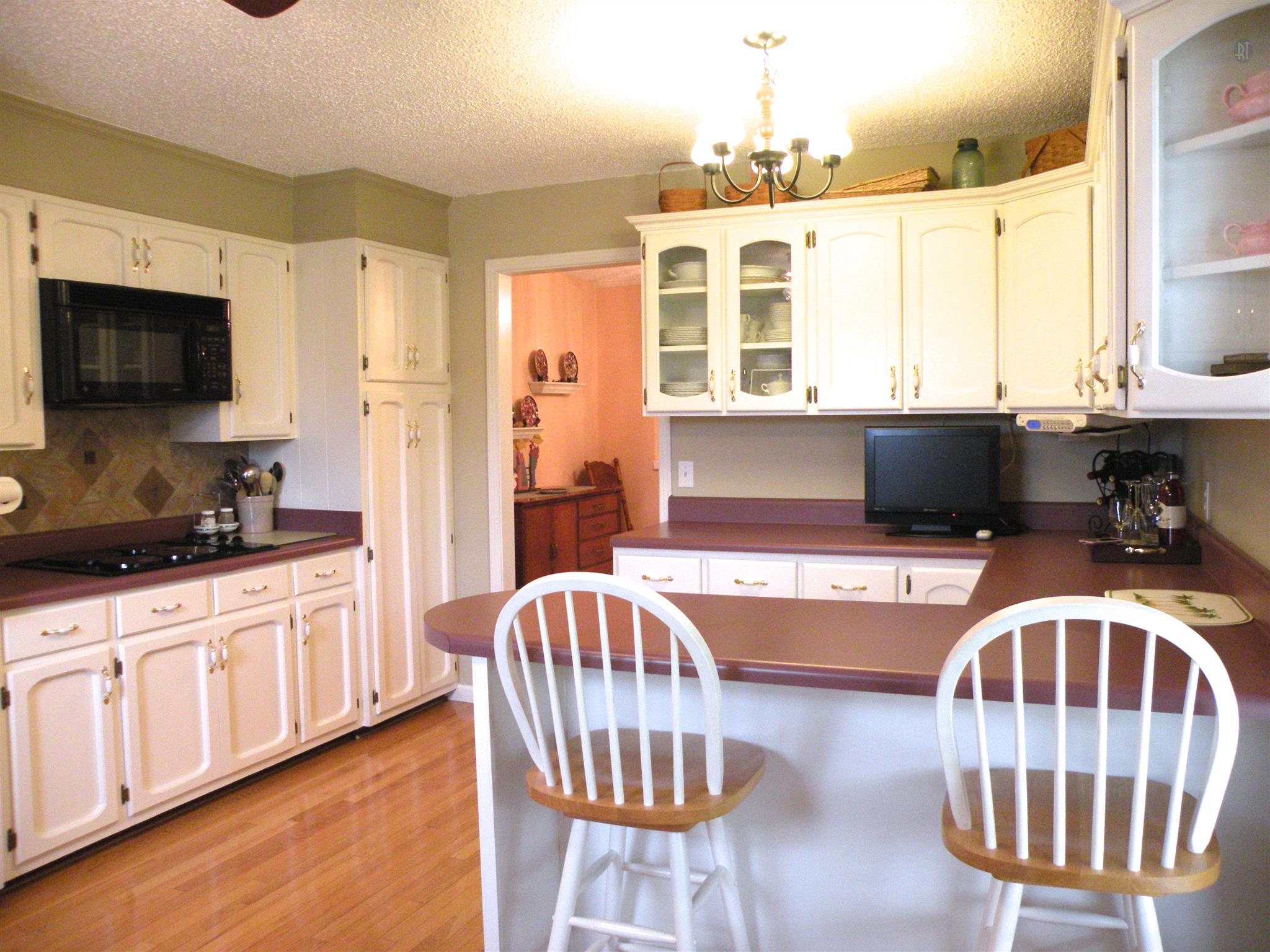 304 Haynes Road Portland, TN 37148 - Photo 14 of 21 a kitchen with stainless steel appliances kitchen island granite countertop a sink and cabinets