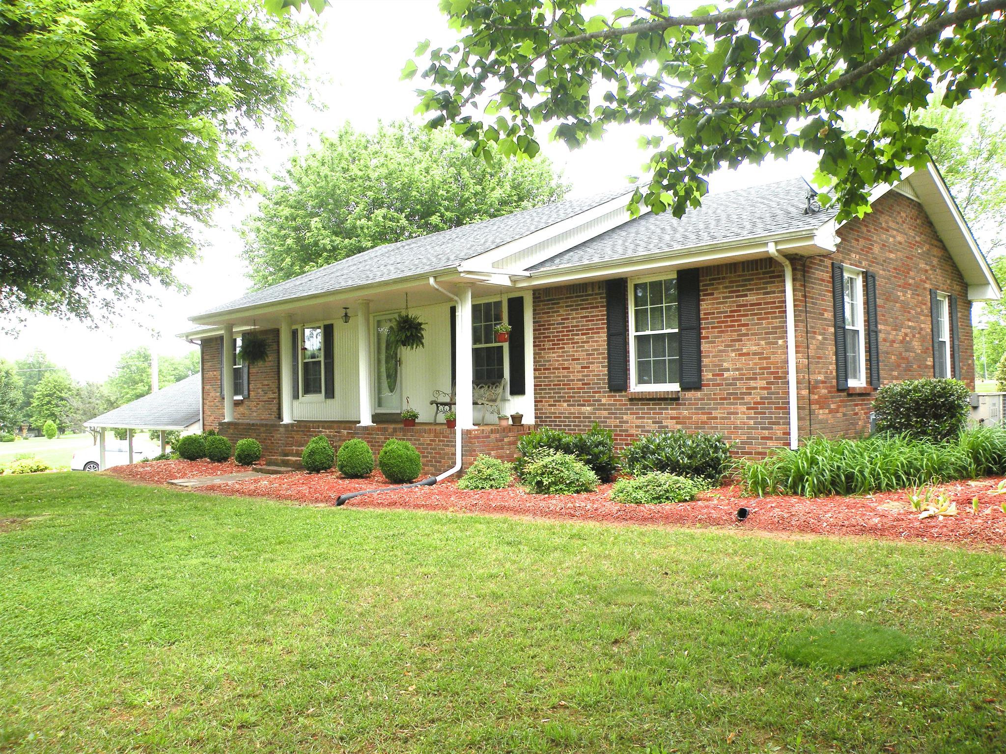 304 Haynes Road Portland, TN 37148 - Photo 20 of 21 a front view of a house with a yard and garage