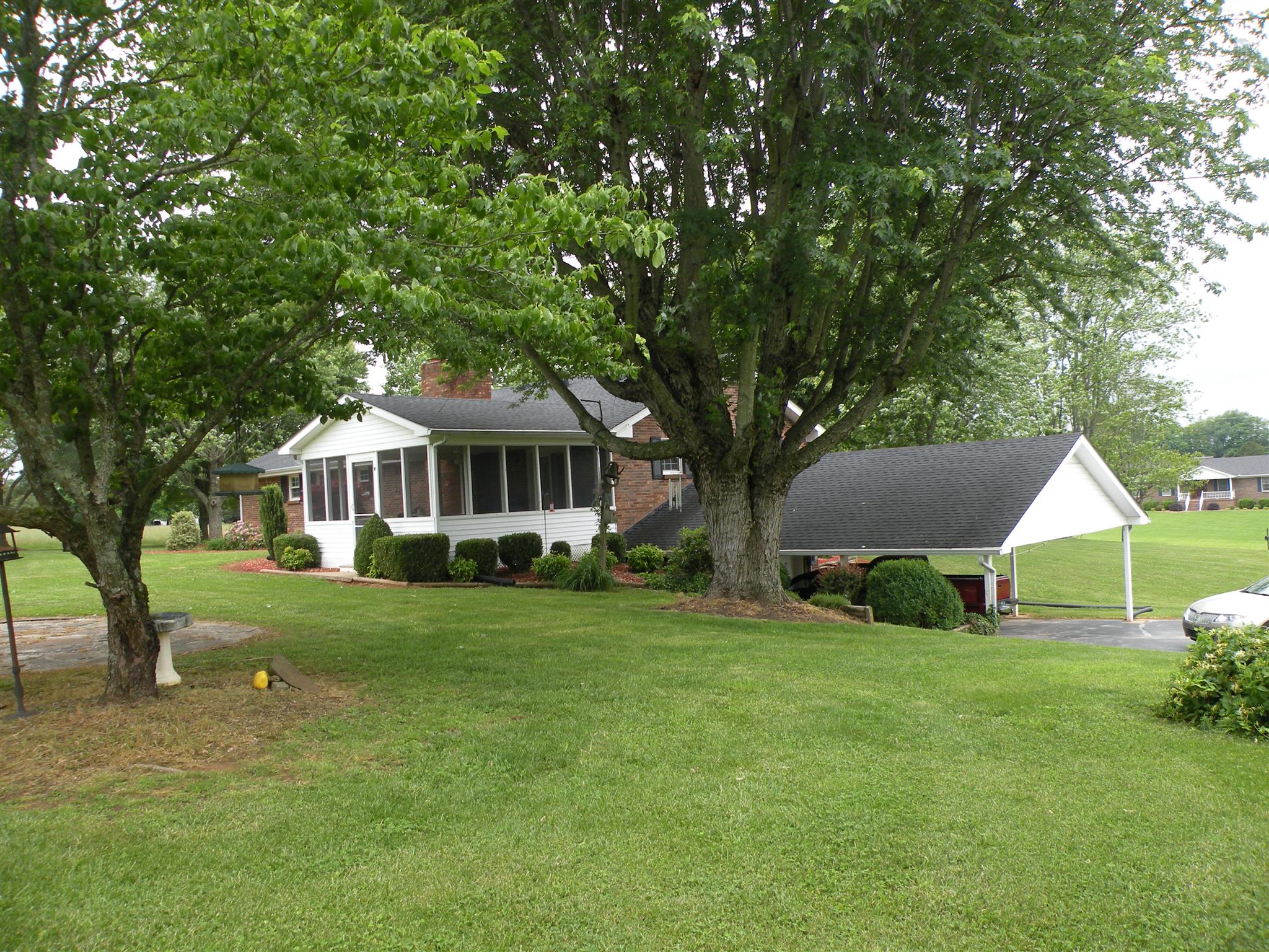 304 Haynes Road Portland, TN 37148 - Photo 3 of 21 a front view of a house with a garden