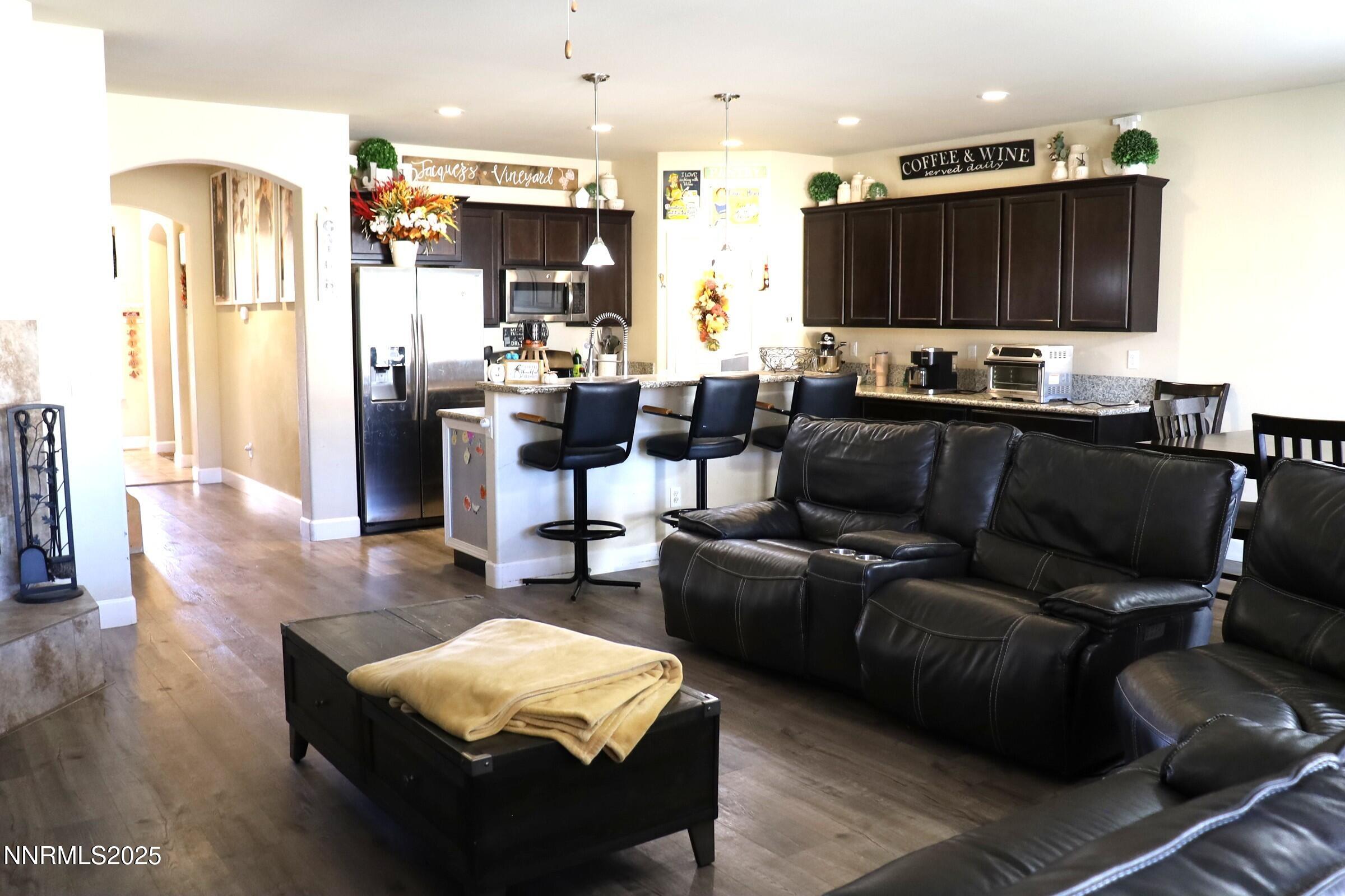 203 Verre Court Dayton, NV 89403 - Photo 13 of 28 a living room with furniture and a flat screen tv