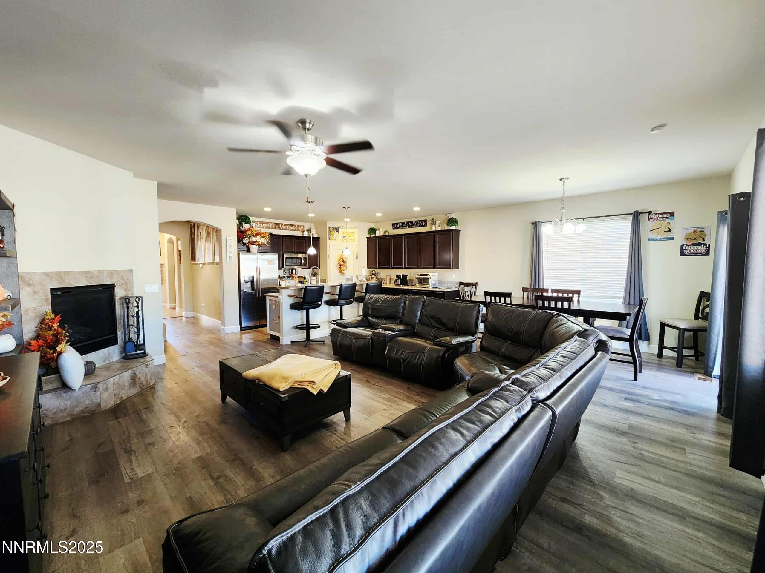 203 Verre Court Dayton, NV 89403 - Photo 14 of 28 a living room with furniture fireplace and a flat screen tv