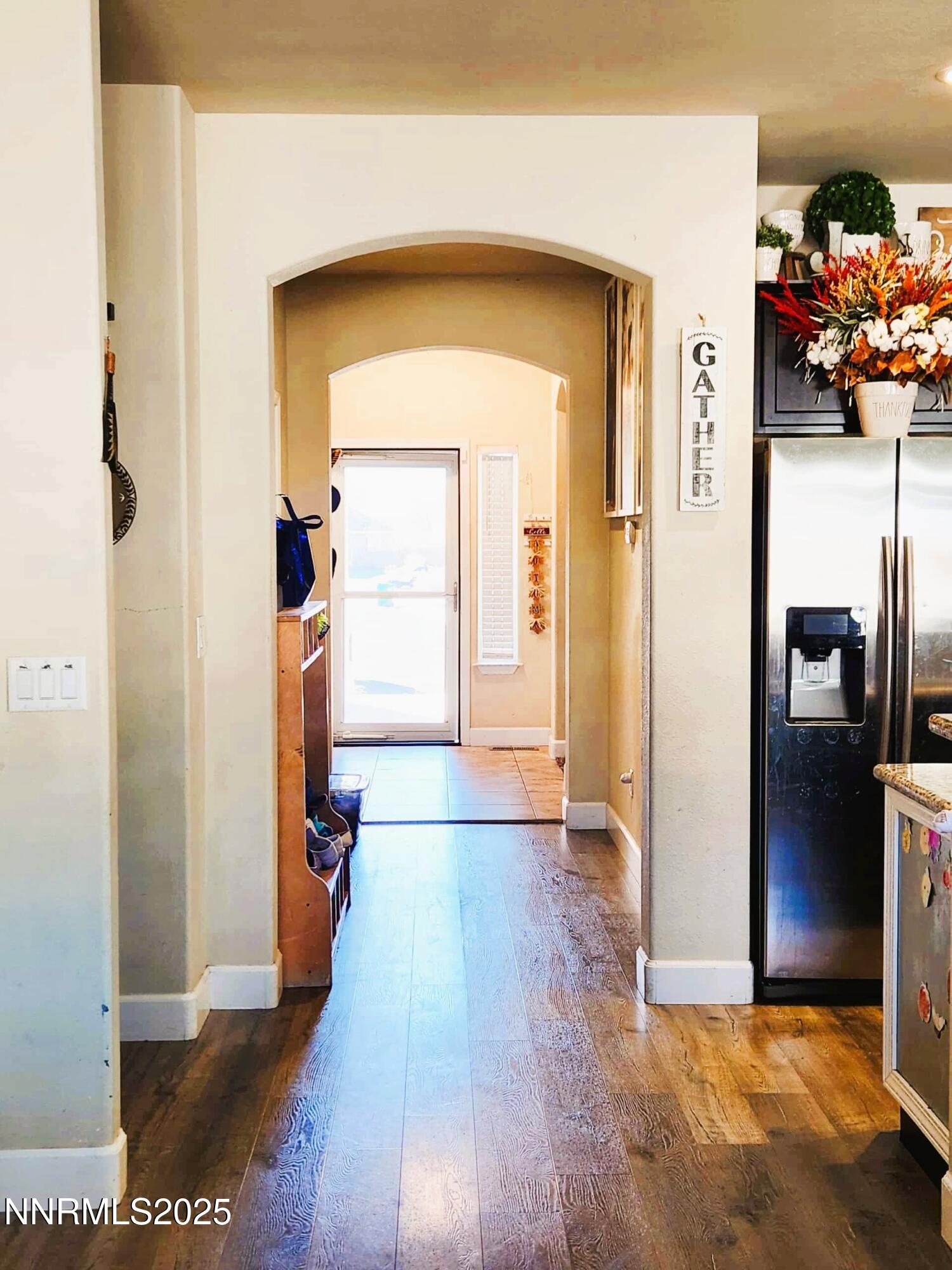 203 Verre Court Dayton, NV 89403 - Photo 9 of 28 a view of a hallway with wooden floor and a living room