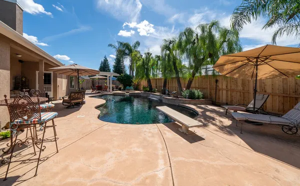 a view of a patio with swimming pool
