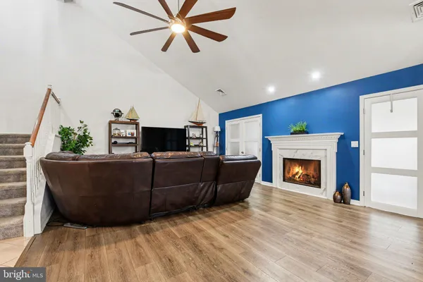 a living room with furniture and a fireplace