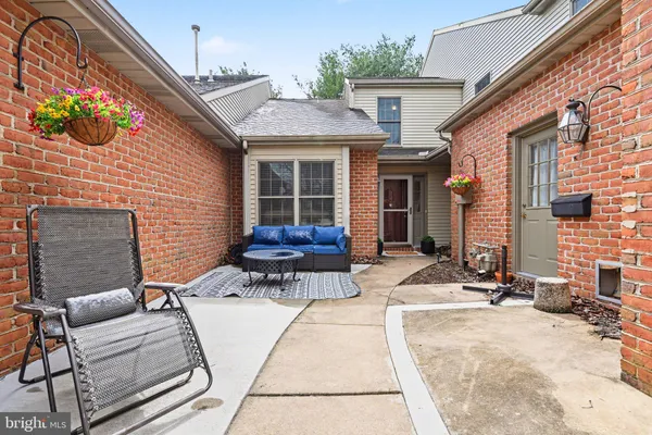 a view of house with patio outdoor seating and entertaining space