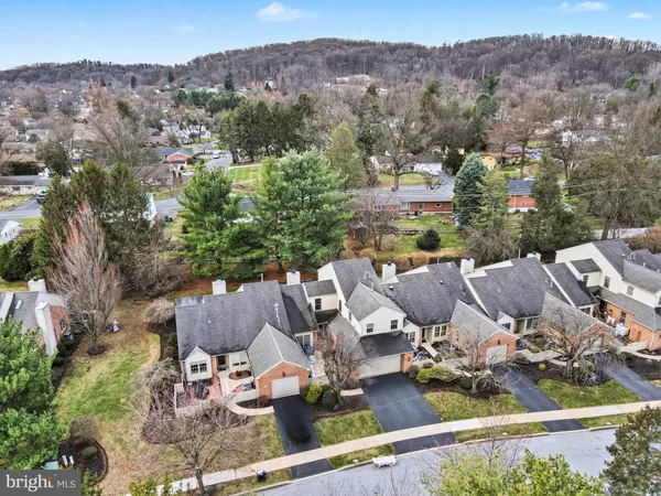 an aerial view of a house with outdoor space