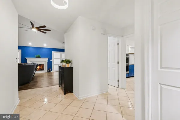 a view of a kitchen with an empty space and a window