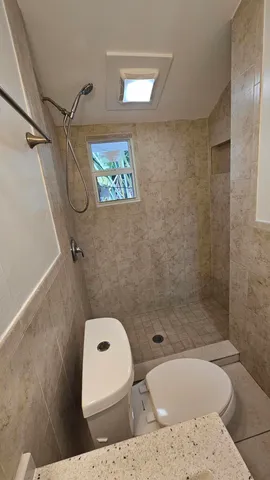 a bathroom with a sink a mirror and a shower