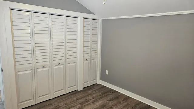 a view of walk in closet with empty room