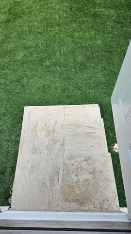 a view of backyard with tub