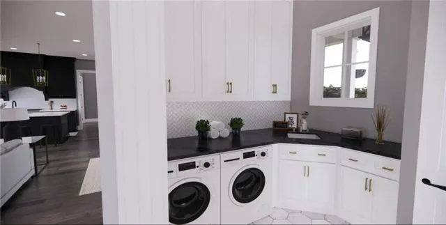 a utility room with dryer and washer