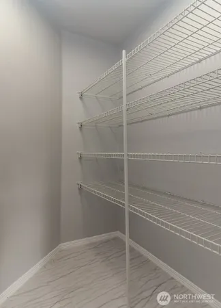 a view of a room with wooden floor and shower