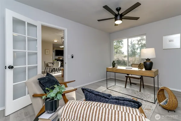 a work room with furniture and a window