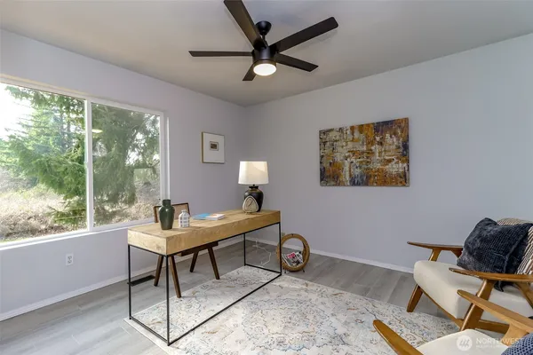 a work room with furniture and a window