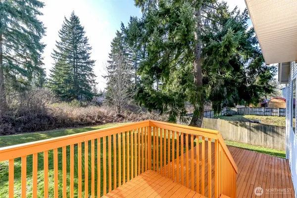 a balcony with trees in front of it