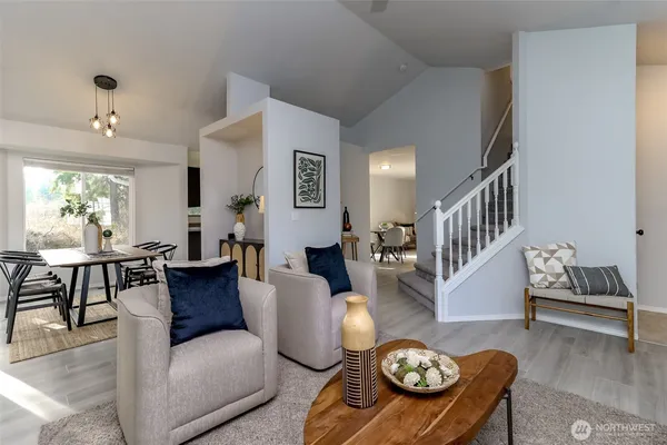 a living room with furniture and a table