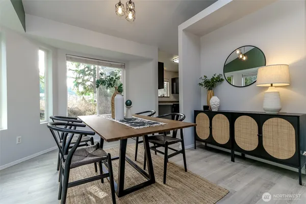 a view of a dining room with furniture window and wooden floor