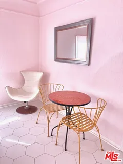 a view of a dining room with furniture and table