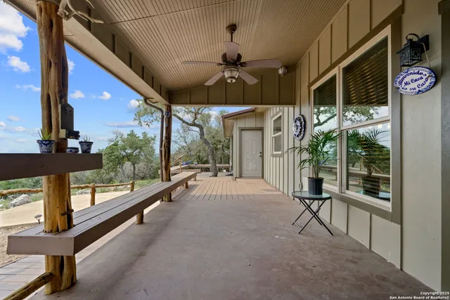 a view of a patio with a table and chairs