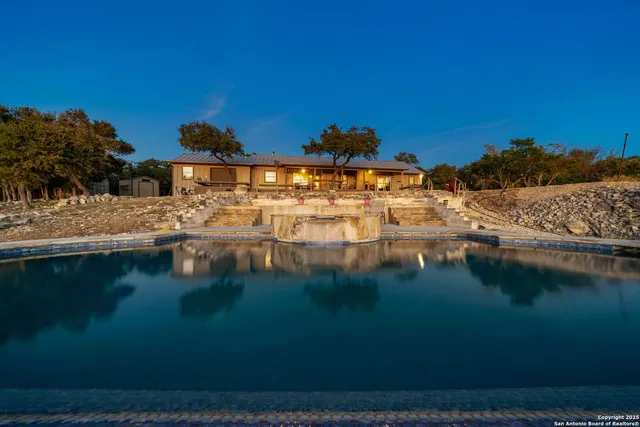 a view of residential houses with outdoor space and lake view