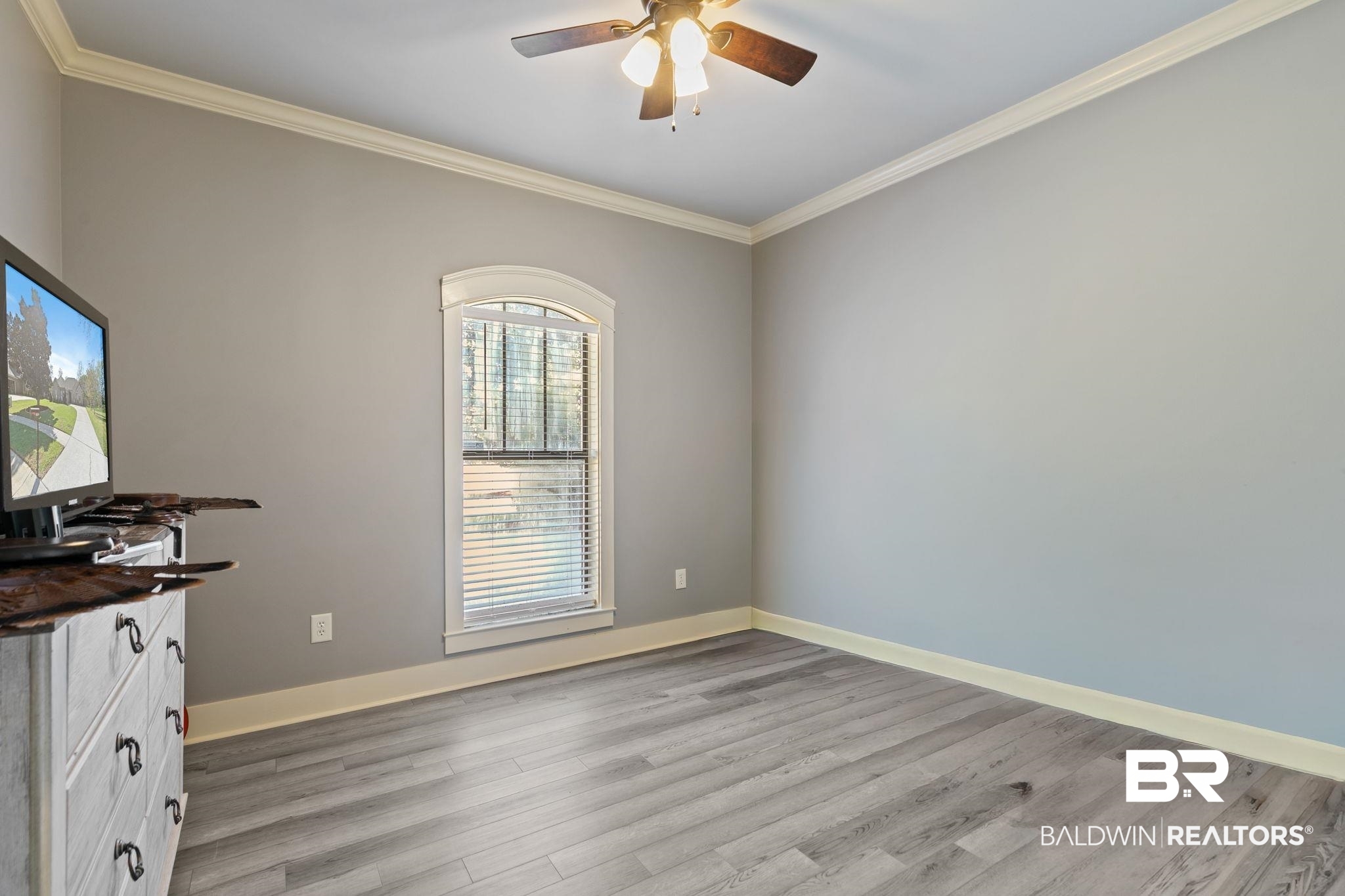 9584 Sanibel Loop Daphne, AL 36526 - Photo 29 of 48 Unfurnished office featuring crown molding, a ceiling fan, and light wood-style floors