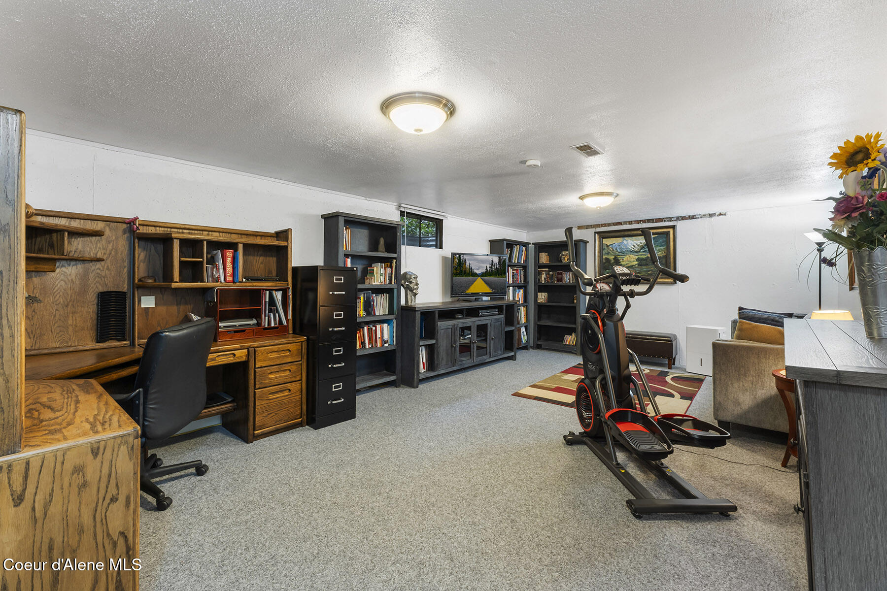 9490 North Atlas Road Hayden, ID 83835 - Photo 20 of 39 Spacious Rec Room & Workout Area