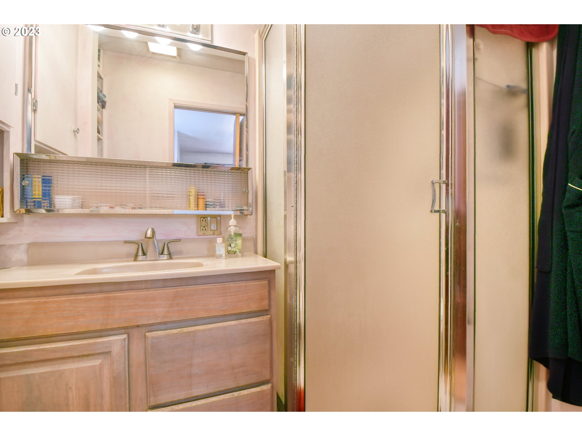 3049 Southwest Kirk Avenue Pendleton, OR 97801 - Photo 19 of 31 a bathroom with a sink a mirror and a vanity