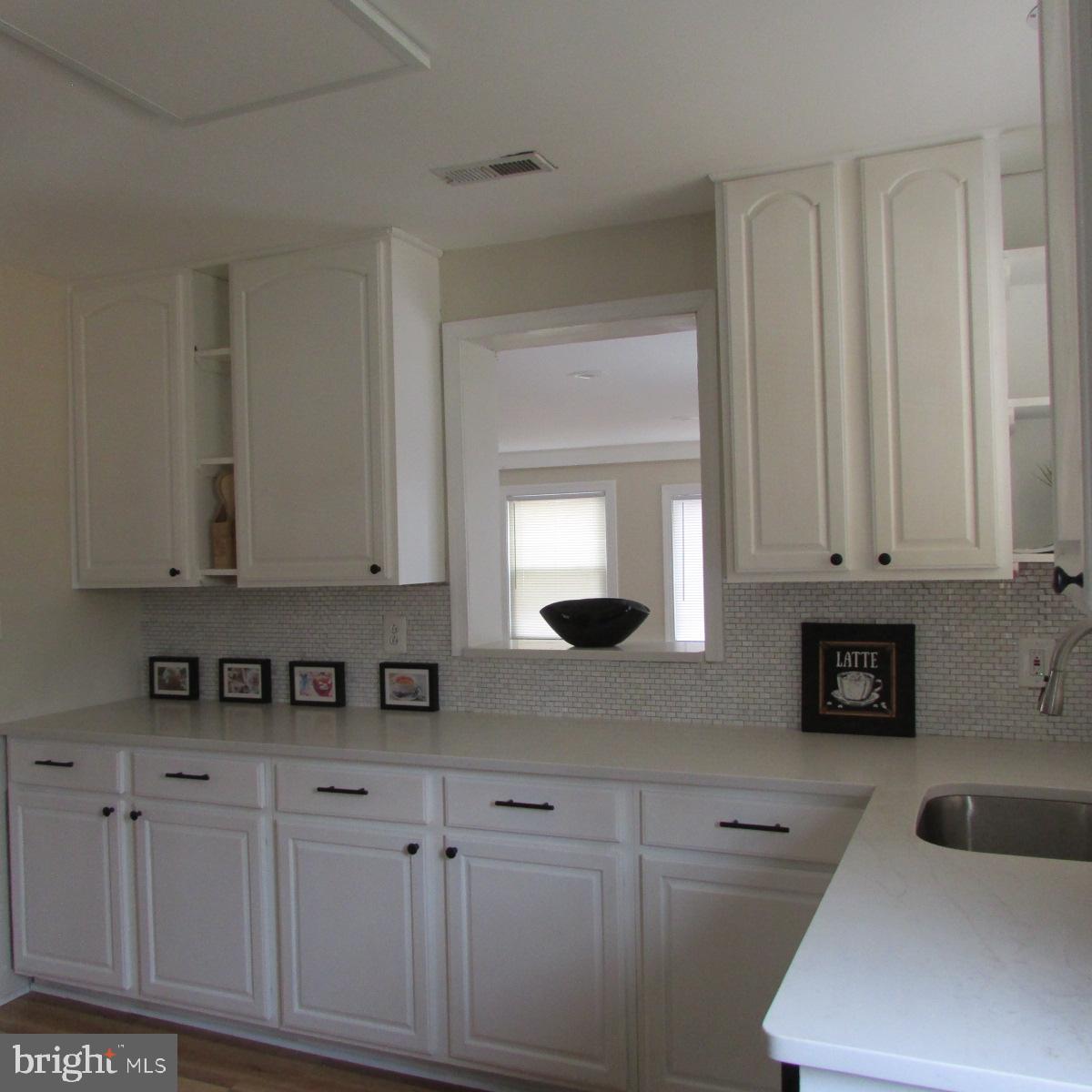 3605 Enterprise Road Bowie, MD 20721 - Photo 11 of 23 a kitchen with white cabinets and sink
