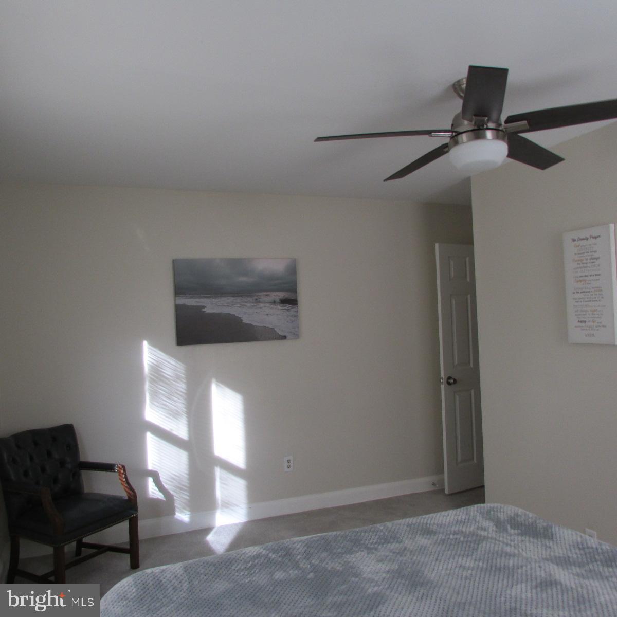 3605 Enterprise Road Bowie, MD 20721 - Photo 17 of 23 a hallway with a piano and wooden floor