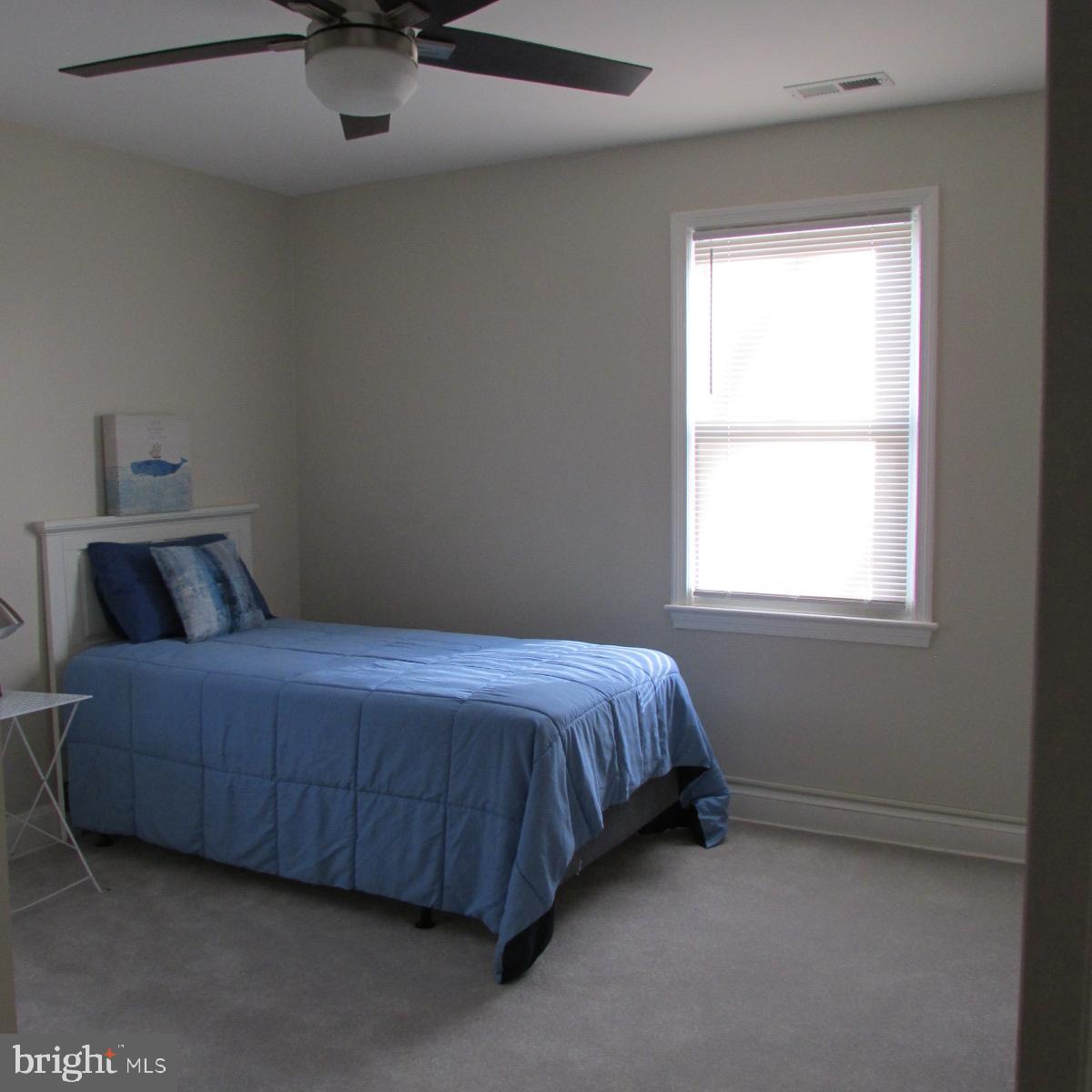 3605 Enterprise Road Bowie, MD 20721 - Photo 19 of 23 a bed room with a bed and a window