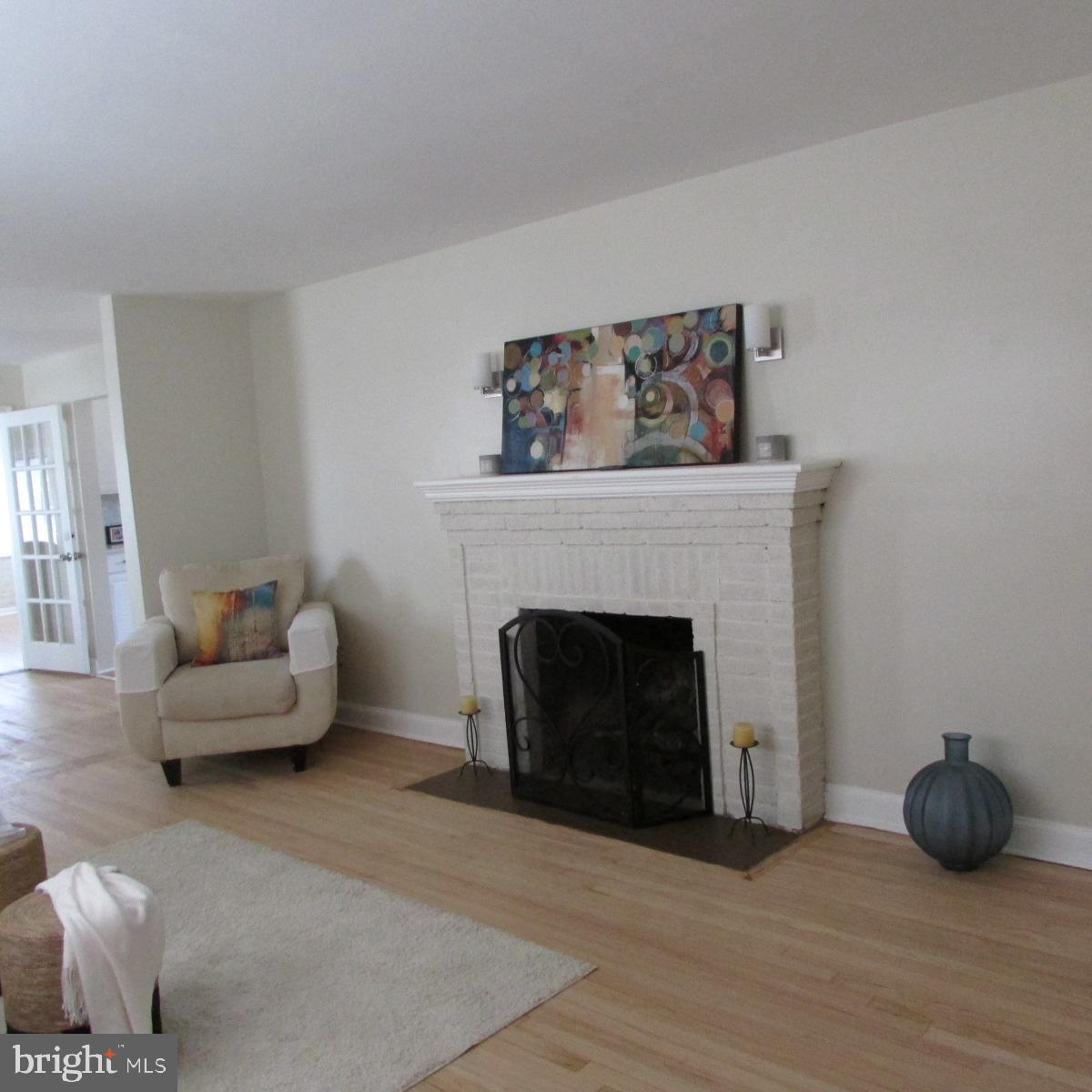 3605 Enterprise Road Bowie, MD 20721 - Photo 4 of 23 a living room with furniture and a fireplace