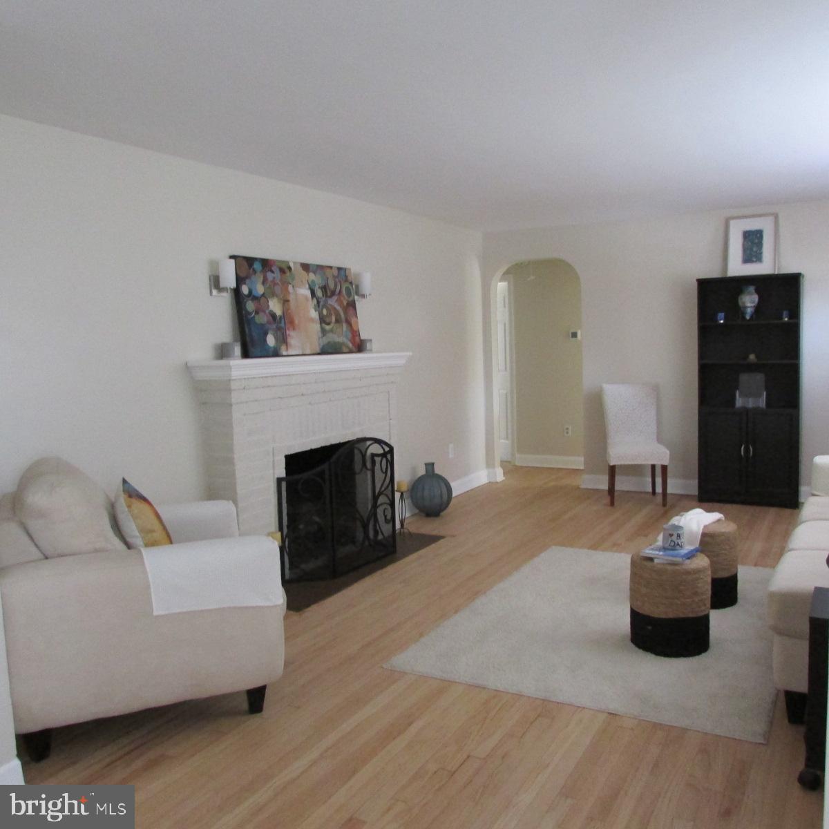 3605 Enterprise Road Bowie, MD 20721 - Photo 6 of 23 a bedroom with furniture and a fireplace