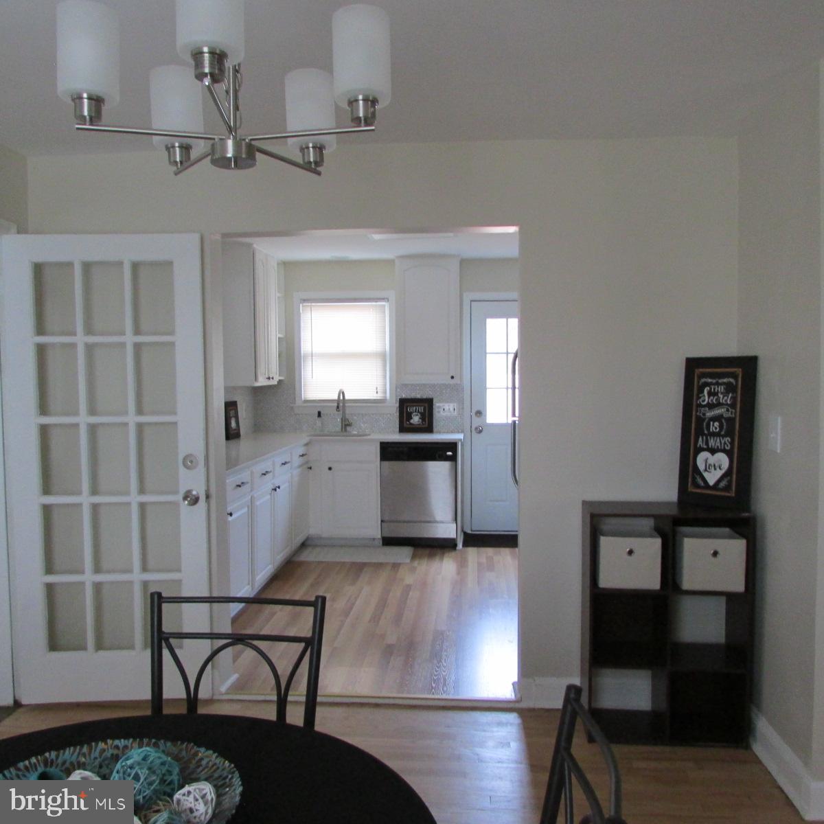 3605 Enterprise Road Bowie, MD 20721 - Photo 9 of 23 a kitchen with kitchen island white cabinets and stainless steel appliances